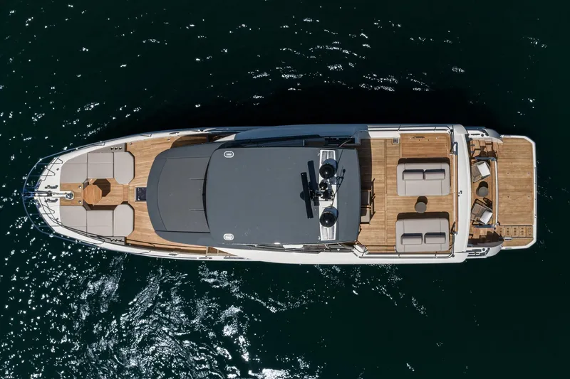 Slide: The Image of Top view of 2024 Prestige X60 yacht on water, showcasing luxurious deck layout. - 2