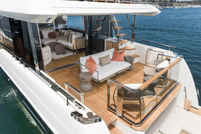 Slide: The Image of Luxurious 2024 Prestige X60 yacht with elegant outdoor seating and modern interior design. - 24