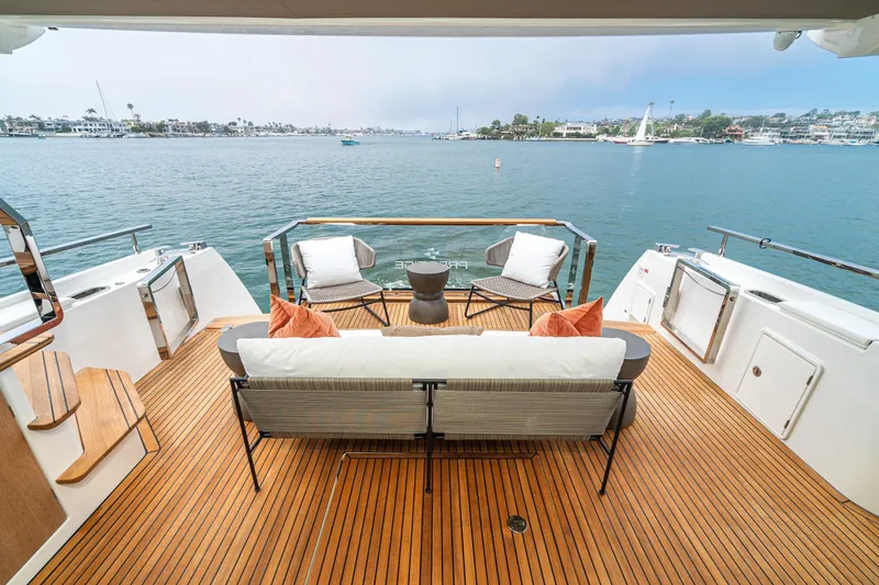 Slide: The Image of Luxurious 2024 Prestige X60 yacht deck with elegant seating and scenic ocean view. - 28