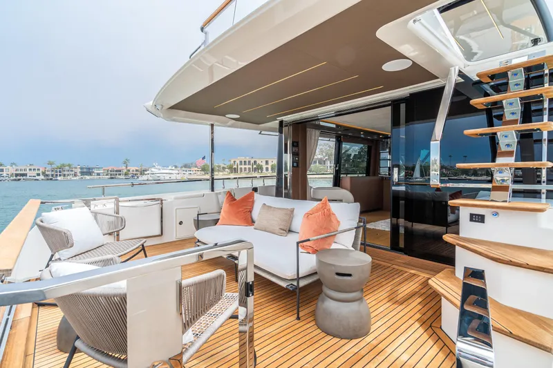 Slide: The Image of Luxurious 2024 Prestige X60 yacht deck with modern seating and elegant design. - 29