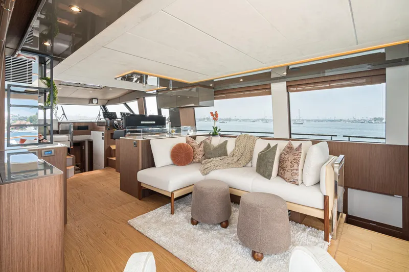 Slide: The Image of Luxurious interior of 2024 Prestige X60 yacht with elegant seating and panoramic windows. - 35