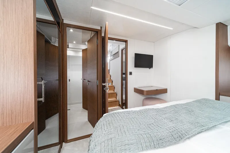 Slide: The Image of Luxurious interior of 2024 Prestige X60 yacht with modern design and wooden accents. - 44