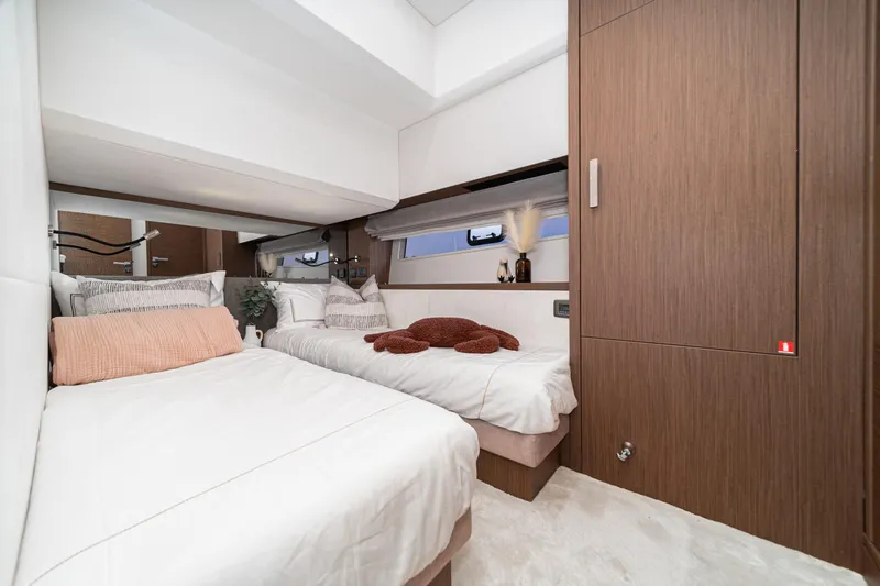 Slide: The Image of Luxurious twin bedroom in 2024 Prestige X60 yacht, featuring modern design and cozy decor. - 46