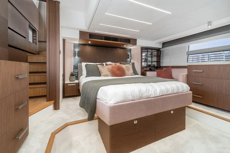 Slide: The Image of Luxurious 2024 Prestige X60 yacht bedroom with modern design and elegant wood finishes. - 48