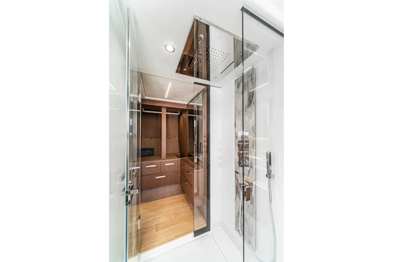 Slide: The Image of Luxurious interior of 2024 Prestige X60 yacht featuring modern shower and wooden cabinetry. - 53