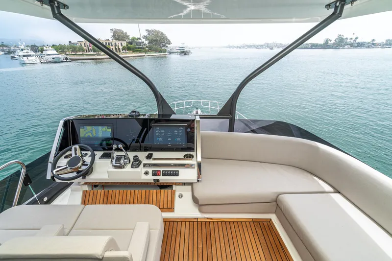 Slide: The Image of Luxurious 2024 Prestige X60 yacht helm with modern navigation system and elegant seating. - 9