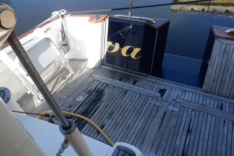 Slide: The Image of Linssen DS 45 yacht cruising on open water, 2001 model, sleek design, blue hull. - 10