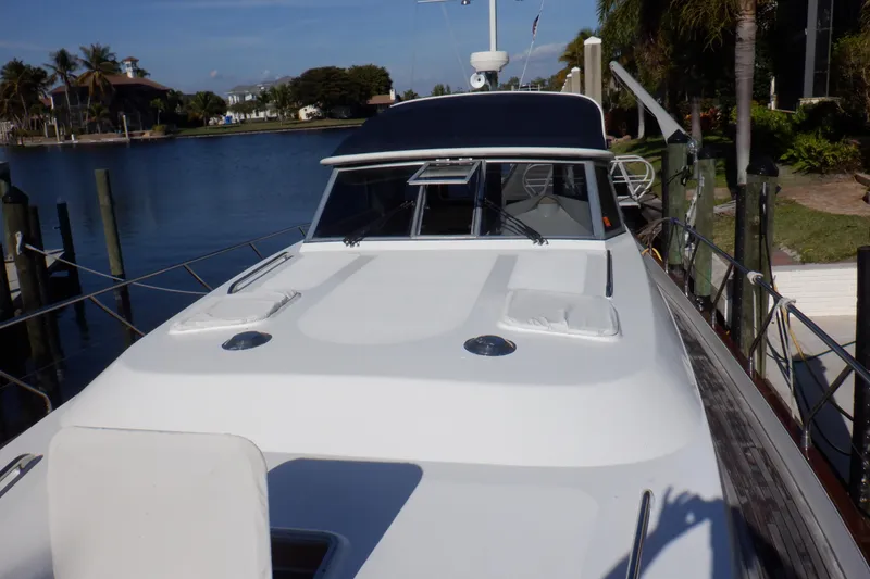 Slide: The Image of Linssen DS 45 yacht, 2001 model, with American flag against clear blue sky. - 15