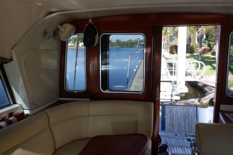 Slide: The Image of 2001 Linssen DS 45 yacht cruising on calm waters under clear blue sky. - 17