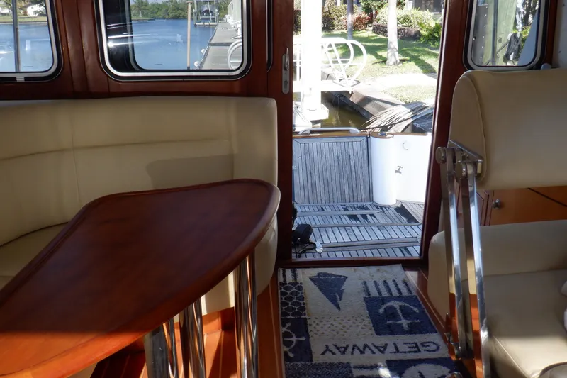 Slide: The Image of Bow of 2001 Linssen DS 45 yacht on calm water, showcasing deck details. - 19