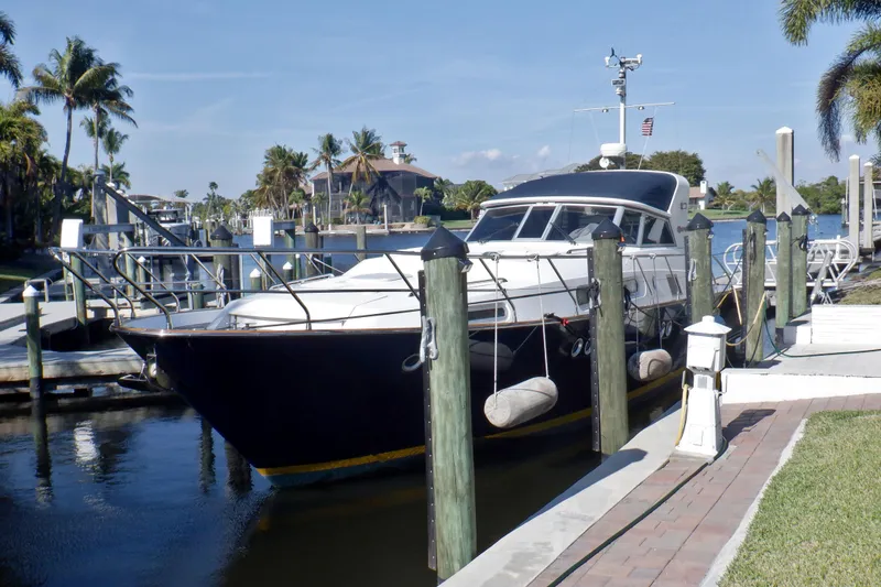 Slide: The Image of Linssen DS 45 yacht cruising on open water, 2001 model, sleek design. - 2