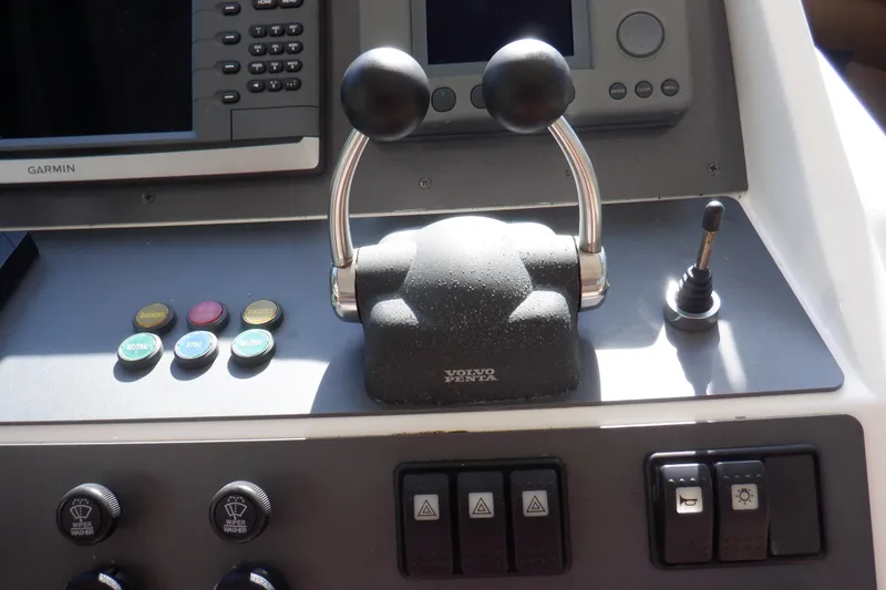 Slide: The Image of Interior of 2001 Linssen DS 45 yacht with helm, controls, and wooden cabinetry. - 31