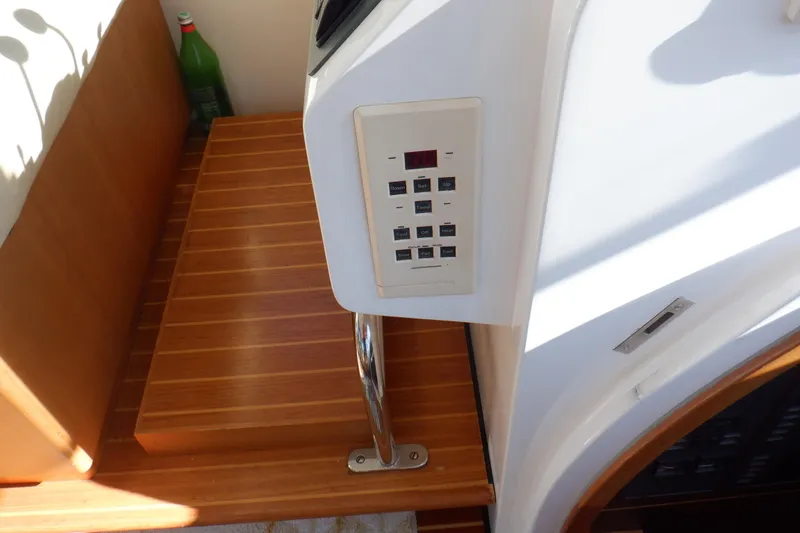 Slide: The Image of Interior of 2001 Linssen DS 45 yacht with helm, seating, and wooden cabinetry. - 32