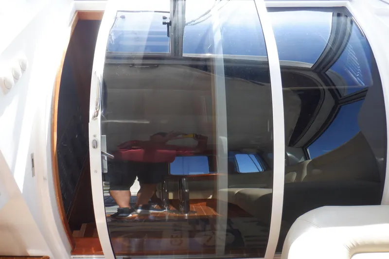 Slide: The Image of Cockpit of 2001 Linssen DS 45 yacht with navigation controls and wooden steering wheel. - 33