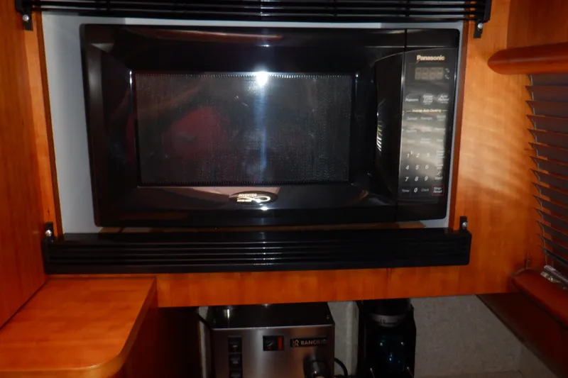 Slide: The Image of Interior of 2001 Linssen DS 45 yacht with wooden bunk beds and storage. - 37