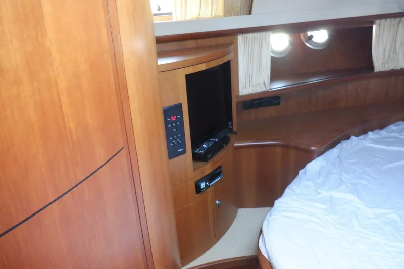 Slide: The Image of Interior of 2001 Linssen DS 45 yacht with wood paneling and cream leather seating. - 44