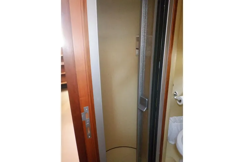 Slide: The Image of Compact bathroom in 2001 Linssen DS 45 yacht with sink, toilet, and mirror. - 46