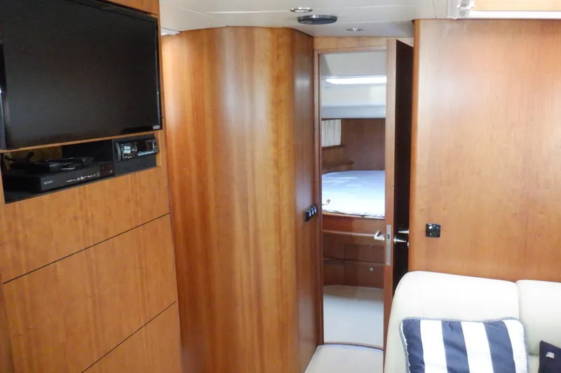 Slide: The Image of Interior of 2001 Linssen DS 45 yacht with wood paneling and cozy bedroom. - 47