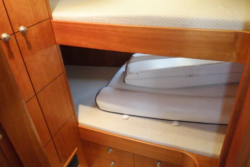 Slide: The Image of Luxurious interior of 2001 Linssen DS 45 yacht with wood paneling and cozy bedding. - 49