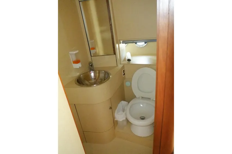 Slide: The Image of Luxurious cabin interior of 2001 Linssen DS 45 yacht with elegant bedding and wood finish. - 51