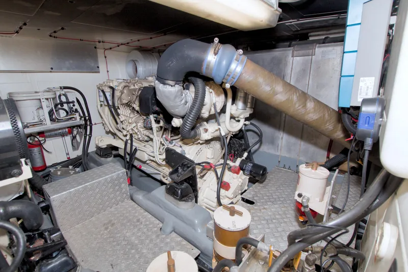 Slide: The Image of Engine room of 2001 Linssen DS 45 yacht, featuring complex machinery and piping. - 67
