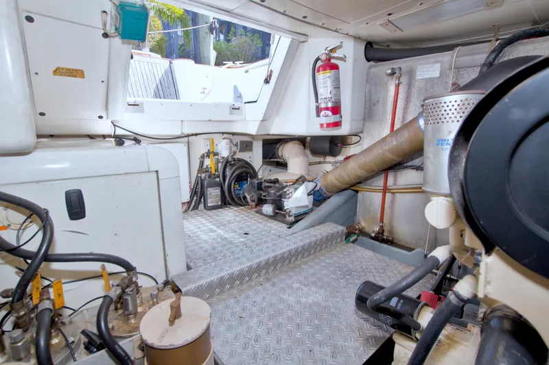 Slide: The Image of Engine room of 2001 Linssen DS 45 yacht with equipment and fire extinguisher. - 72