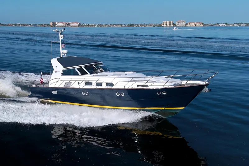 Slide: The Image of 2001 Linssen DS 45 yacht cruising on calm blue waters. - 80