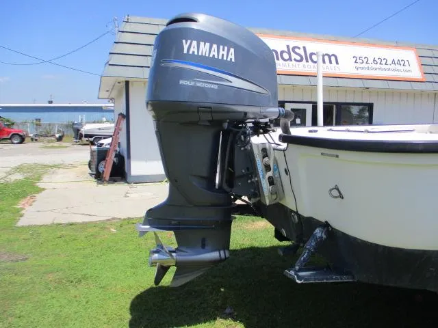 Slide: The Image of Yamaha outboard motor on a 2002 Everglades 250 Center Console boat. - 12