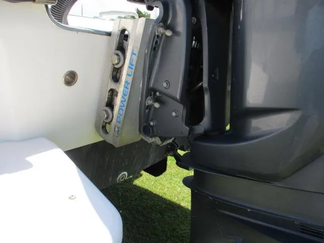 Slide: The Image of Close-up of a 2002 Everglades 250 Center Console boat motor. - 14
