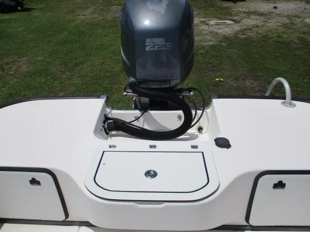 Slide: The Image of Everglades 250 Center Console boat engine, 2002 model, parked on grass. - 15
