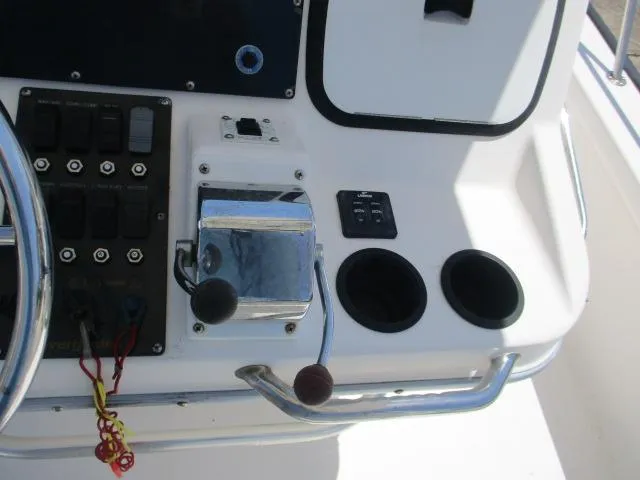 Slide: The Image of Control console of a 2002 Everglades 250 Center Console boat. - 37