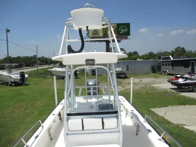 Slide: The Image of 2002 Everglades 250 Center Console boat displayed on grass. - 45