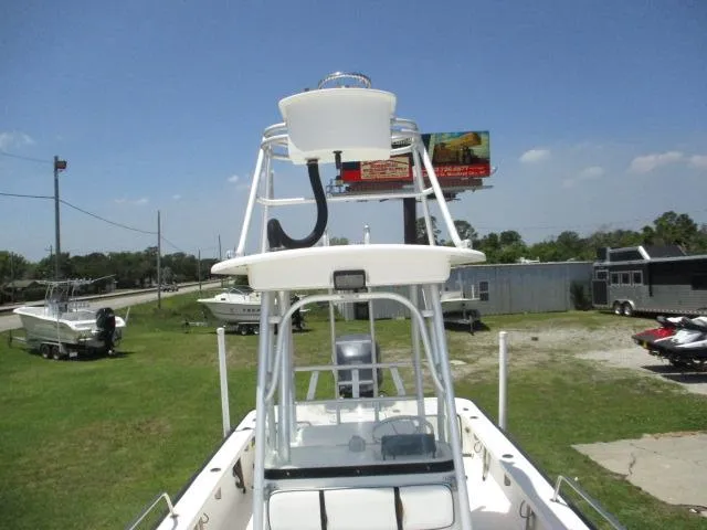 Slide: The Image of 2002 Everglades 250 Center Console boat on a grassy lot. - 46
