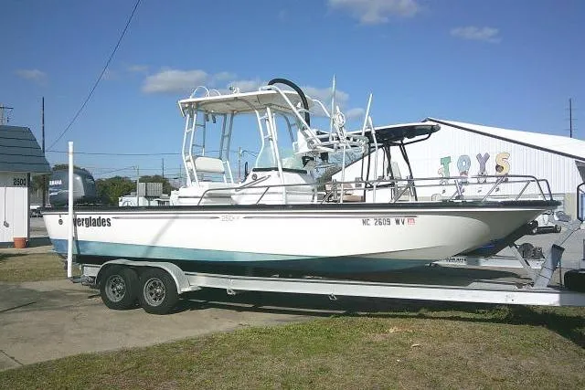Slide: The Image of 2002 Everglades 250 Center Console boat on trailer, parked outdoors. - 50