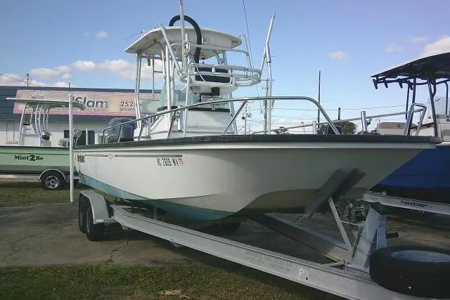 Slide: The Image of 2002 Everglades 250 Center Console boat on trailer, parked outdoors. - 51