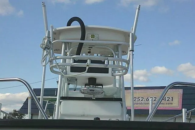Slide: The Image of 2002 Everglades 250 Center Console boat with tower against blue sky backdrop. - 52