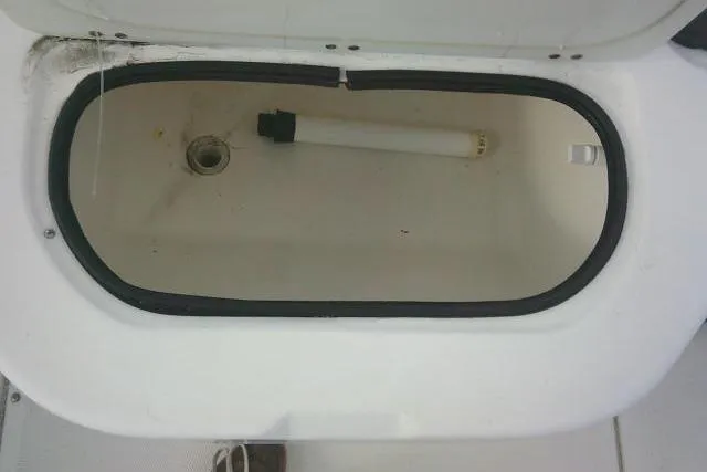 Slide: The Image of Open storage compartment on 2002 Everglades 250 Center Console boat. - 59