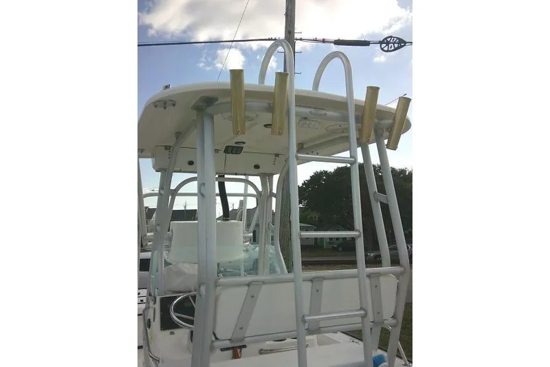 Slide: The Image of 2002 Everglades 250 Center Console boat with T-top and rod holders. - 61