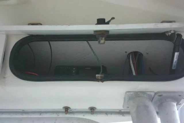Slide: The Image of Storage compartment of 2002 Everglades 250 Center Console boat with visible wiring. - 63