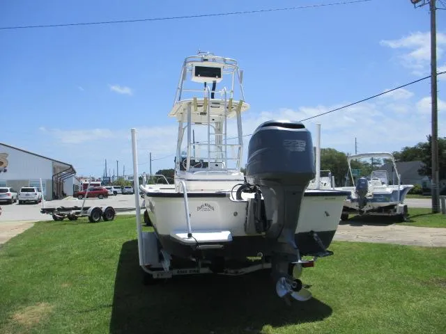 Slide: The Image of 2002 Everglades 250 Center Console boat parked on grass. - 9