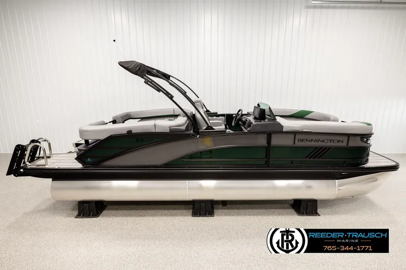 The Image of 2026 Bennington MOFBSF pontoon boat in showroom, side view, sleek design. - 1