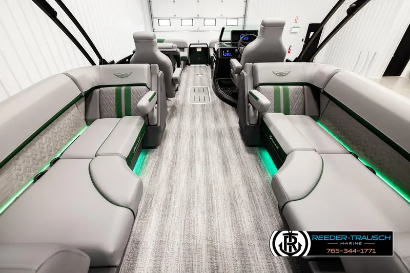 Slide: The Image of 2026 Bennington MOFBSF boat interior with luxurious seating and ambient lighting. - 16
