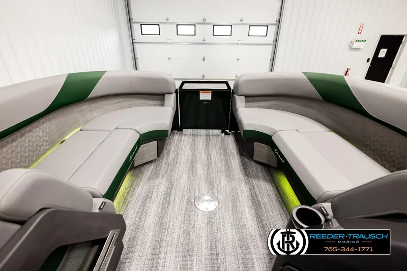 Slide: The Image of 2026 Bennington MOFBSF boat interior with gray and green seating, modern design. - 18