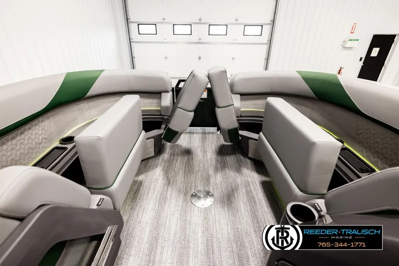 Slide: The Image of 2026 Bennington MOFBSF boat interior with modern seating and green accents. - 20