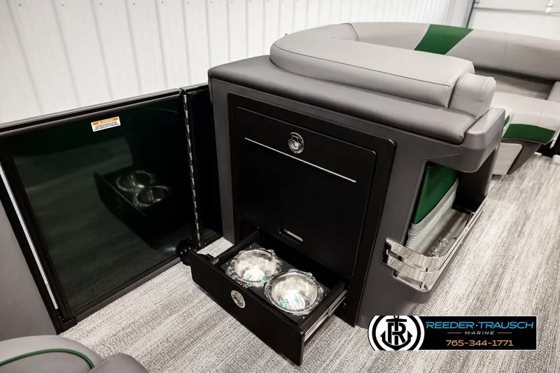 Slide: The Image of 2026 Bennington MOFBSF boat interior with storage compartments and seating. - 23