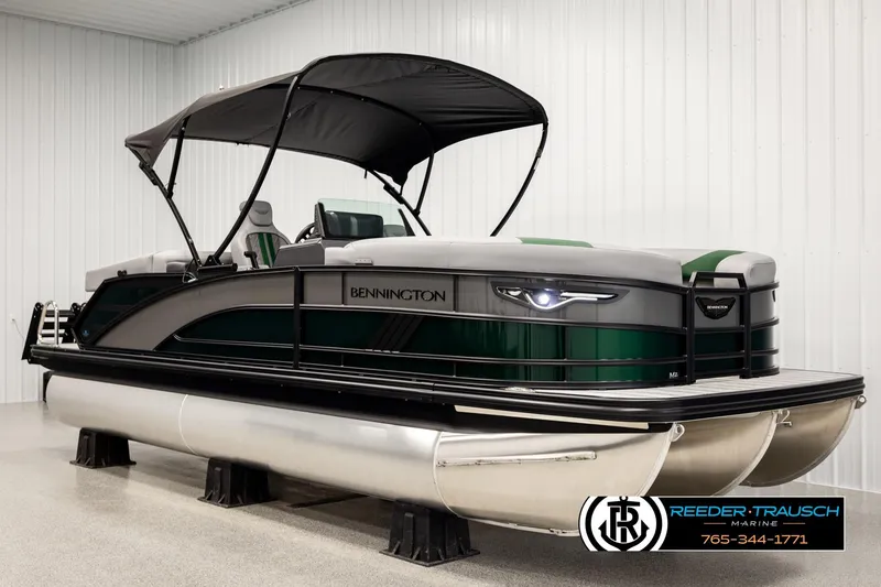 Slide: The Image of 2026 Bennington MOFBSF pontoon boat with canopy in showroom. - 3
