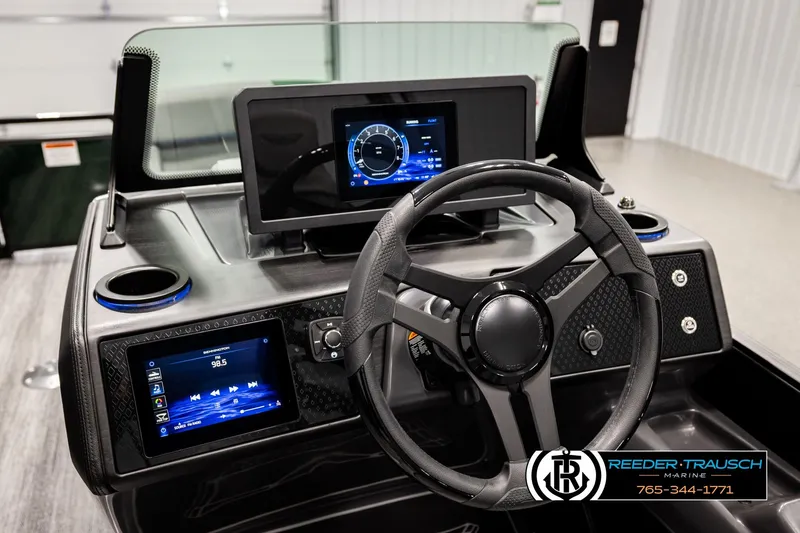 Slide: The Image of 2026 Bennington MOFBSF boat dashboard with modern steering wheel and digital displays. - 31