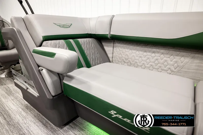 Slide: The Image of Luxurious Bennington MOFBSF 2026 boat seating with green accents and quilted design. - 38