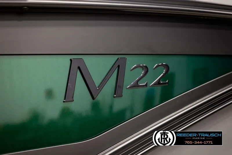 Slide: The Image of 2026 Bennington MOFBSF M22 boat with green and black detailing. - 46
