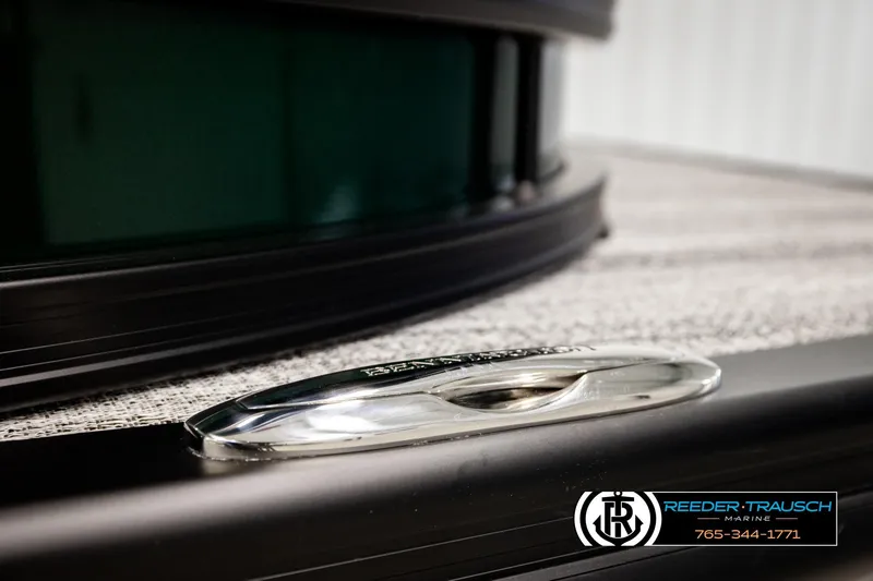 Slide: The Image of Close-up of 2026 Bennington MOFBSF boat detail with Reeder-Trausch Marine logo. - 48